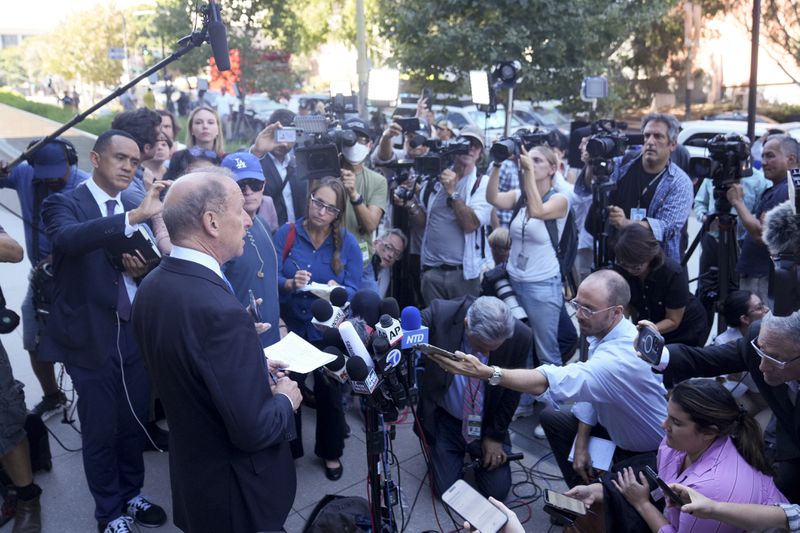 Abbe Lowell, left, an attorney for Hunter Biden, makes a statement after Biden pled guilty to federal tax charges, Thursday, Sept. 5, 2024, in Los Angeles. (AP Photo/Eric Thayer)