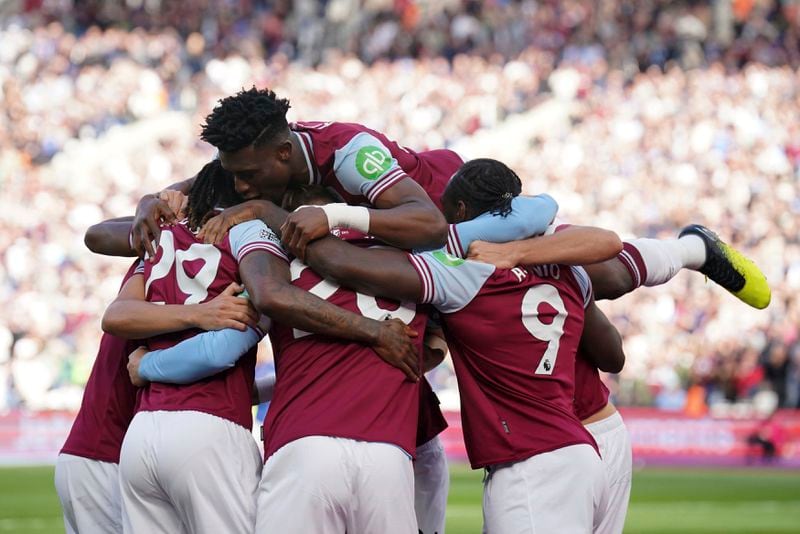 West Ham United's Michail Antonio, right, celebrates scoring their side's first goal of the game during the Premier League match between West Ham United and Ipswich at the London Stadium, Saturday Oct. 5, 2024. (Jonathan Brady/PA via AP)