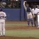 Mets catcher Gary Carter waves in his team’s outfielders just before Braves relief pitcher Rick Camp hits an 18th-inning home run in a legendary 1985 game.