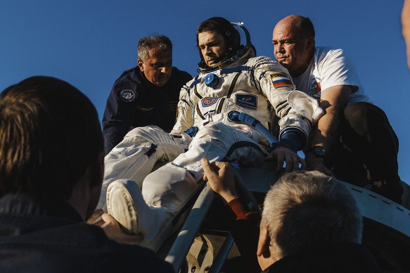 In this photo released by Roscosmos space corporation, rescue team members help Roscosmos cosmonaut Nikolai Chub to get from the capsule shortly after the landing of the Russian Soyuz MS-25 space capsule carrying NASA astronaut Tracy Dyson, Roscosmos cosmonauts Oleg Kononenko and Nikolai Chub, south-east of the Kazakh town of Zhezkazgan, Kazakhstan, Monday, Sept. 23, 2024. (Ivan Timoshenko, Roscosmos space corporation via AP)