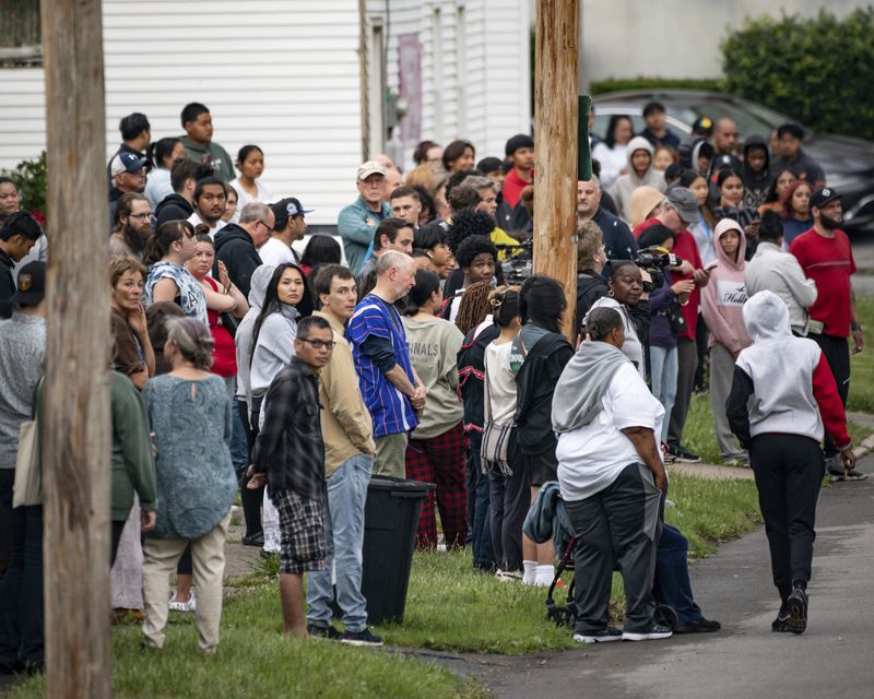 People line Shaw Street during a vigil for 13-year-old Nyah Mway in Utica, N.Y., Saturday, June 29, 2024. On Friday, June 28, Mway was fatally shot by police who’d tackled him to the ground after he allegedly pointed what turned out to be a BB gun at them during a foot chase. (Daniel DeLoach/Observer-Dispatch via AP)
