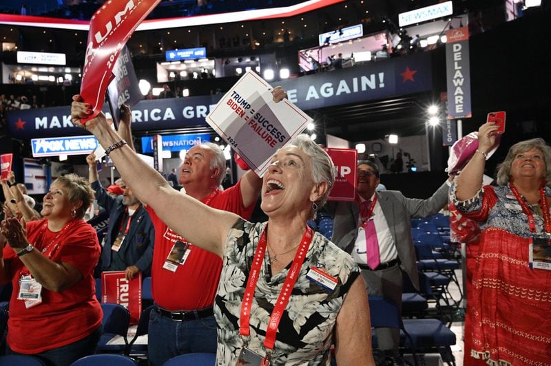 Georgia delegates react to the program at the Republican National Convention in Milwaukee.