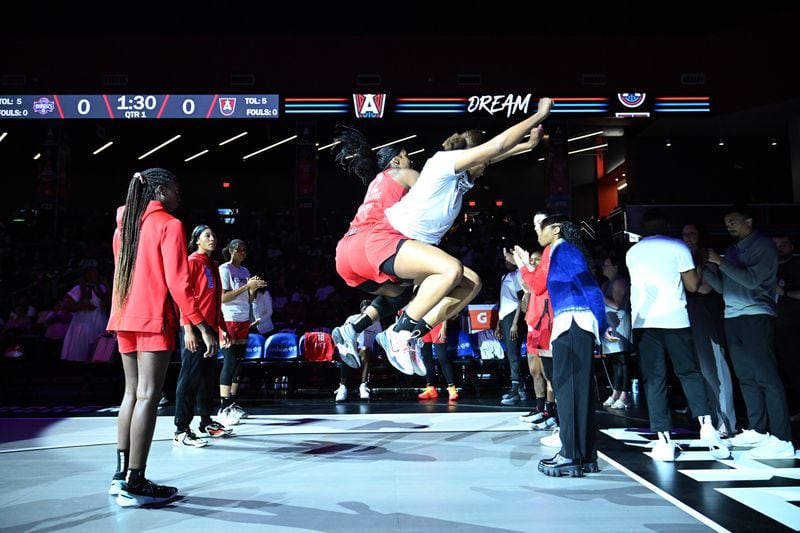 Atlanta Dream forward Cheyenne Parker-Tyus (32) gets fired up with a teammate before the start of WNBA game against Washington Mystics at the Gateway Center Arena on June 11, 2024, in Atlanta. (Hyosub Shin / AJC)