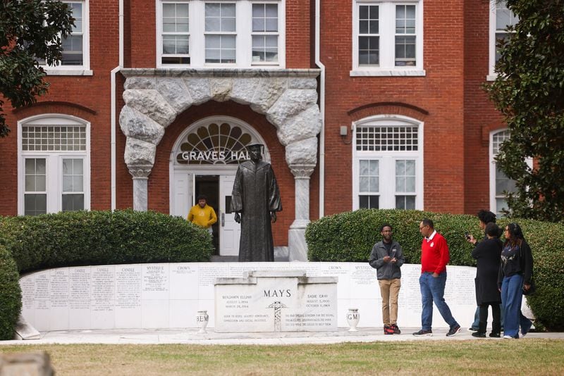 A tour guide ushers prospective students to the Benjamin E. Mays Memorial, in front of Graves Hall on the Morehouse College campus, on March 18, 2024, in Atlanta. (Jason Getz/The Atlanta Journal-Constitution/TNS)