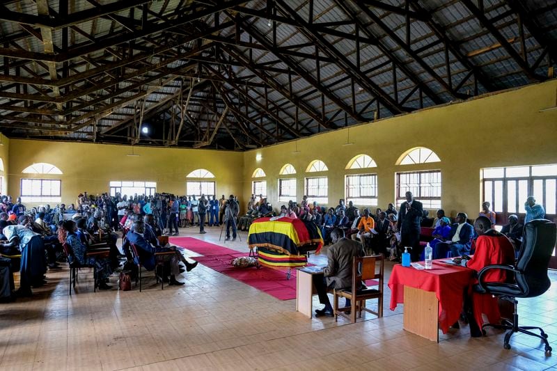 Members of the public gather for a funeral service of Ugandan Olympic athlete Rebecca Cheptegei ahead of her burial in Kapkoros, Bukwo District, Uganda Saturday, Sept. 14. 2024. (AP Photo/Hajarah Nalwadda)