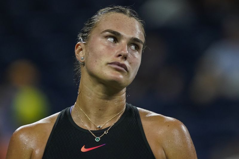 Aryna Sabalenka, of Belarus, reacts after losing a point against Elise Mertens, of Belgium, in the fourth round of the U.S. Open tennis championships, Sunday, Sept. 1, 2024, in New York. (AP Photo/Eduardo Munoz Alvarez)