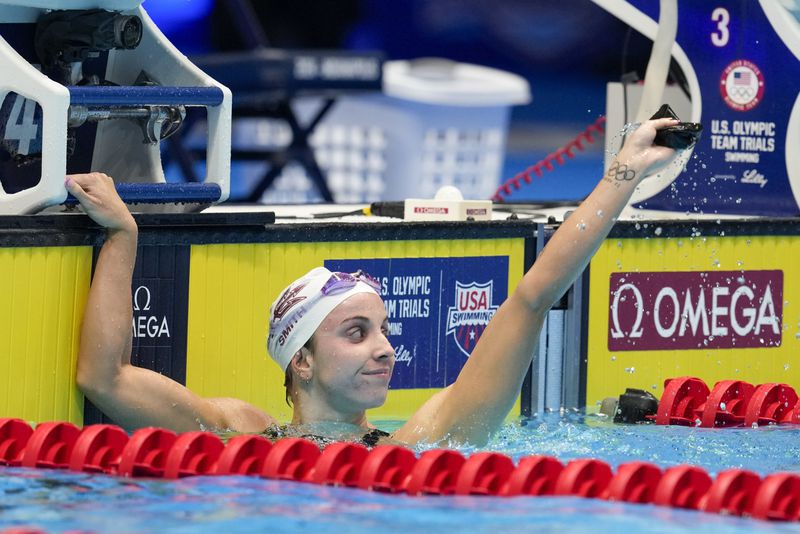 Regan Smith celebrates after a Women's 100 backstroke semifinals Monday, June 17, 2024, at the US Swimming Olympic Trials in Indianapolis. (AP Photo/Darron Cummings)