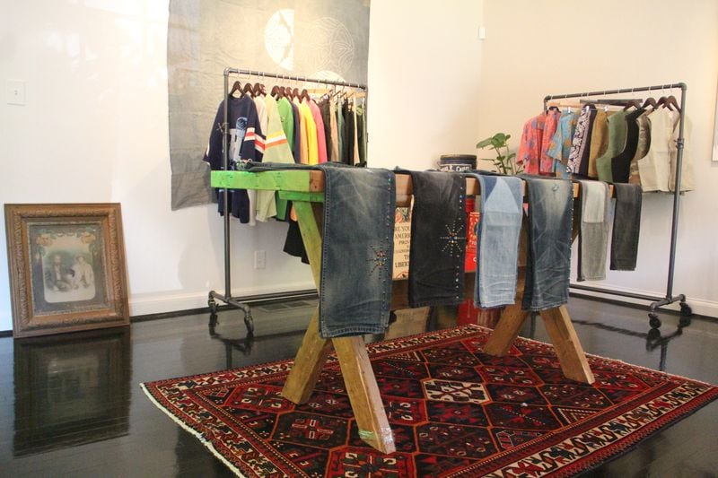 Denim and other clothing displayed in the main showroom at The Heavy Market.