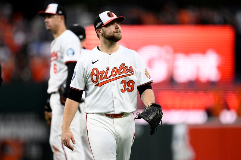 Baltimore Orioles starting pitcher Corbin Burnes (39) walks back to the dugout after he was removed in the ninth inning during Game 1 of an AL Wild Card Series baseball game against the Kansas City Royals, Tuesday, Oct. 1, 2024, in Baltimore. The Royals won 1-0. (AP Photo/Nick Wass)