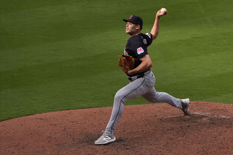 Cleveland Guardians relief pitcher Cade Smith throws during the eighth inning of a baseball game against the Kansas City Royals Monday, Sept. 2, 2024, in Kansas City, Mo. (AP Photo/Charlie Riedel)