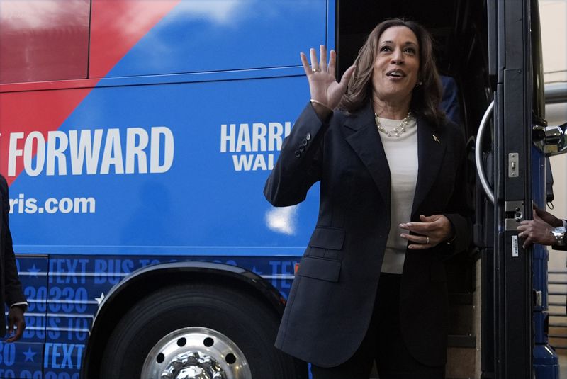 Democratic presidential nominee Vice President Kamala Harris waves as she exits her campaign bus in Savannah, Ga., Wednesday, Aug. 28, 2024. (AP Photo/Jacquelyn Martin)