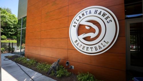 The Atlanta Hawks logo is shown at the players entrance to the practice facility in the Brookhaven area, Thursday, May 16, 2024, in Atlanta. The Atlanta Hawks are giving us access to the areas of the practice facility that are not accessible and areas fans would never see. The areas to be photographed, Main court, locker room, weight room, kitchen, player film room, upstairs conference room, and TV studiio. (Jason Getz / AJC)
