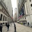 The New York Stock Exchange, right, is shown on Tuesday, Oct. 1, 2024, in New York. (AP Photo/Peter Morgan)