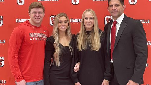 Josh Niblett (right) was introduced as Gainesville's new football coach on Monday, Dec. 13, 2021, with his children (from left) Josh and Sky, and wife, Karon.