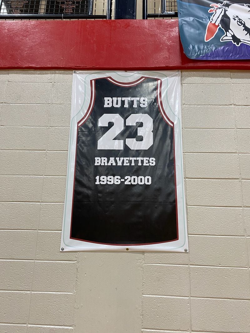 The jersey of Tasha Butts hangs on the way of the gym at Baldwin High,