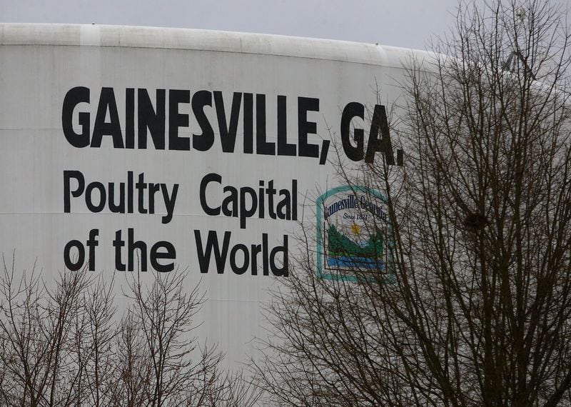 A water tank touts Gainesville as the poultry capital of the world on Monday, Feb 16, 2015, in Gainesville. Curtis Compton / ccompton@ajc.com