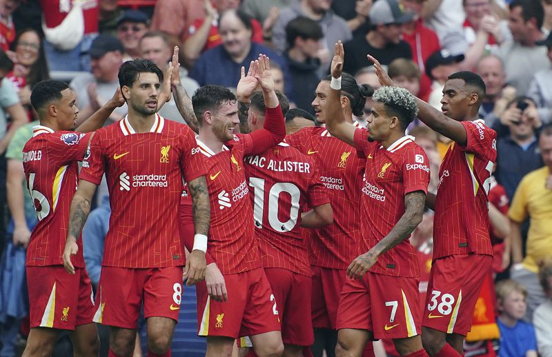 Liverpool's Luis Diaz, second right, celebrates scoring his side's second goal of the game, during the English Premier League soccer match between Liverpool and Bournemouth, at Anfield, in Liverpool, England, Saturday, Sept. 21, 2024. (Peter Byrne/PA via AP)