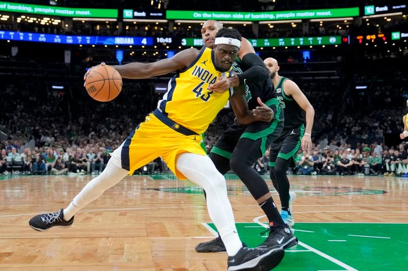 Indiana Pacers forward Pascal Siakam (43) is defended by Boston Celtics center Al Horford during the first half of Game 2 of the NBA Eastern Conference basketball finals Thursday, May 23, 2024, in Boston. (AP Photo/Steven Senne)