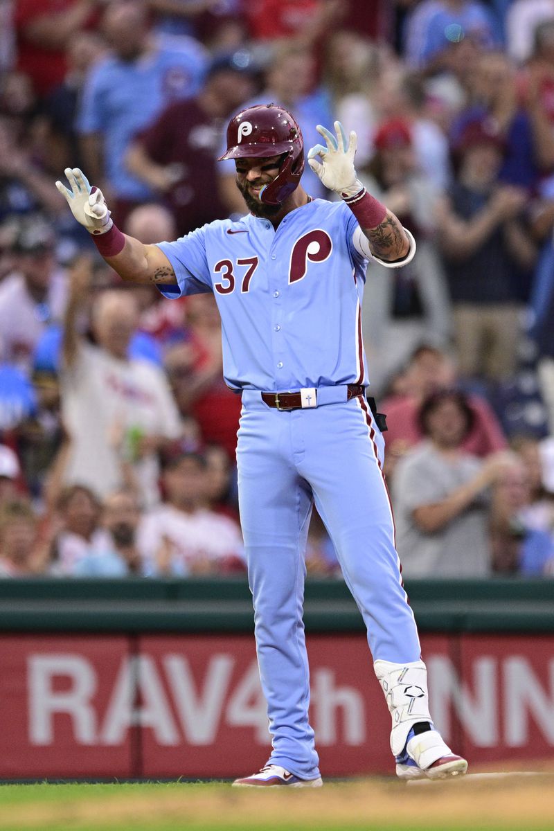 Philadelphia Phillies' Weston Wilson reacts after hitting a triple off Washington Nationals' Mitchell Parker during the fourth inning of a baseball game, Thursday, Aug. 15, 2024, in Philadelphia. (AP Photo/Derik Hamilton)