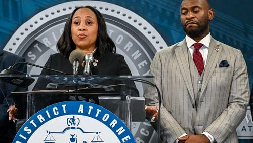 
                        FILE — Fulton County District Attorney Fani Willis appears with special prosecutor Nathan Wade during a press briefing to announce the indictment of former President Donald Trump, in Atlanta on Aug. 14, 2023. The claim that Willis had a relationship with the special prosecutor she hired, Nathan Wade, surfaced on Jan. 8 in a filing from Michael Roman, one of Trump’s co-defendants. (Kenny Holston/The New York Times)
                      
