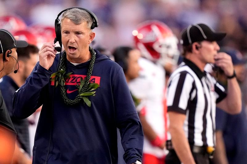 Arizona head coach Brent Brennan watches during the first half of an NCAA college football game against Kansas State Friday, Sept. 13, 2024, in Manhattan, Kan. (AP Photo/Charlie Riedel)