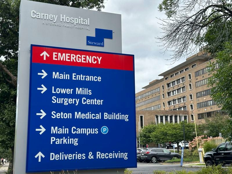 A direction board stands outside Carney Hospital in Boston, Tuesday, Aug. 20, 2024. (AP Photo/Nick Perry)