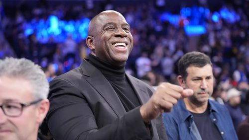 FILE - Magic Johnson waves to people before an NBA basketball game between the New York Knicks and the Los Angeles Lakers Saturday, Feb. 3, 2024, in New York. (AP Photo/Frank Franklin II, File)