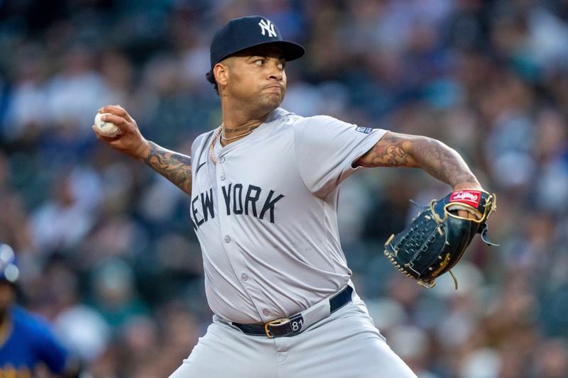 New York Yankees starter Luis Gil delivers a pitch during the first inning of a baseball game against the Seattle Mariners, Tuesday, Sept. 17, 2024, in Seattle. (AP Photo/Stephen Brashear)