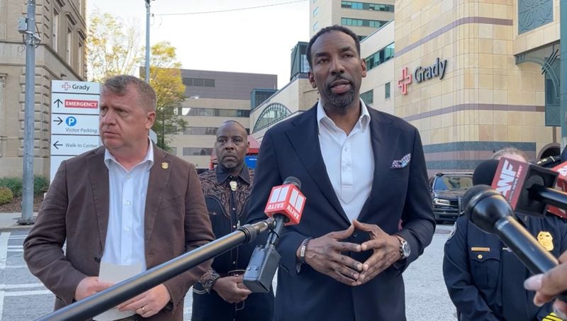 Atlanta Mayor Andre Dickens speaks outside Grady Memorial Hospital on Saturday after three police officers were shot during a struggle with a suspect. 