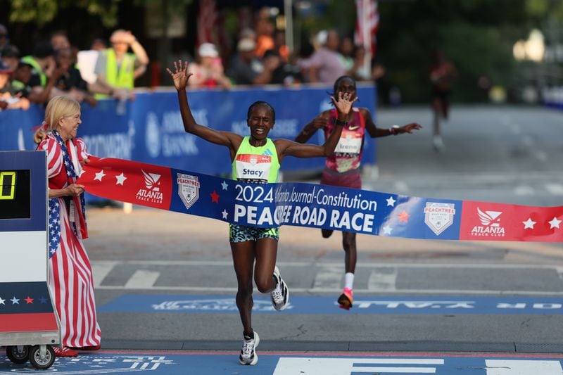 Stacy Ndiwa wins the women’s elite runner division of the 55th running of the Atlanta Journal-Constitution Peachtree Road Race in Atlanta on Thursday, July 4, 2024.   (Jason Getz / AJC)