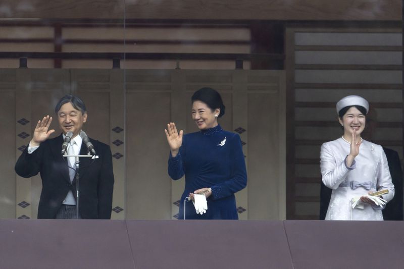 FILE- Japan's Emperor Naruhito, from left, Empress Masako and their daughter Princess Aiko wave to well-wishers from the balcony of the Imperial Palace in Tokyo on Friday, Feb. 23, 2024. (Tomohiro Ohsumi/Pool Photo via AP)