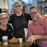 Husband and wife Keith and Nicki Schroeder and their daughter Madison (center) are partners in Schroeder’s Market in Brunswick. (Stephen B. Morton for The Atlanta Journal-Constitution)