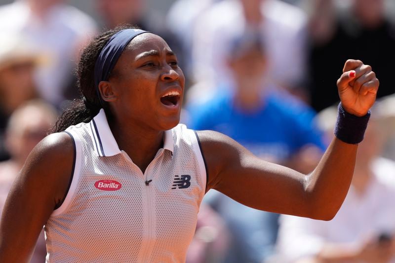 Coco Gauff of the U.S. clenches her fist after scoring a point against Poland's Iga Swiatek during their semifinal match of the French Open tennis tournament at the Roland Garros stadium in Paris, Thursday, June 6, 2024. (AP Photo/Thibault Camus)