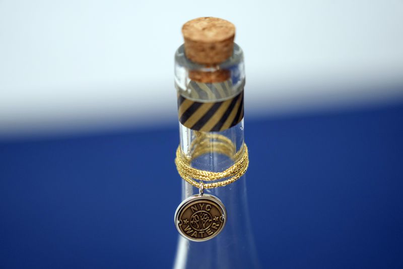 A bottle containing NYC tap water is displayed at a news conference about repairs occurring to the water supply infrastructure in New York, Monday, Sept. 30, 2024. (AP Photo/Seth Wenig)