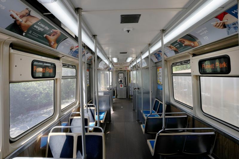 A Chicago Transit Authority Blue Line train car rides empty as it approaches the Forest Park, Ill., station Tuesday, Sept. 3, 2024, in Forest Park. (AP Photo/Charles Rex Arbogast)