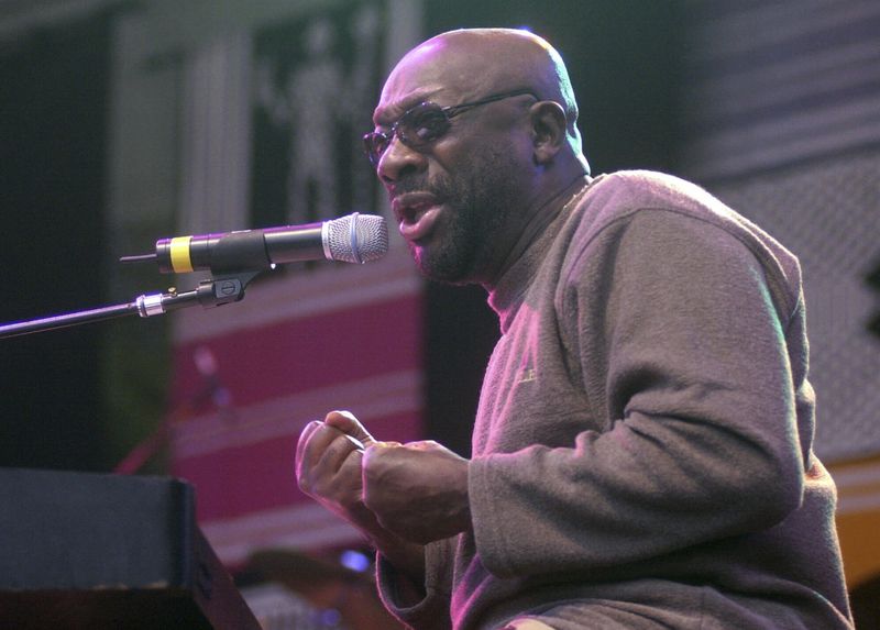 FILE - Isaac Hayes sings to a crowd of people at World of Music and Dance, a three day festival of music, arts and dance, July 27, 2001, in Redmond, Wash. (AP Photo/Frank Franklin II, File)