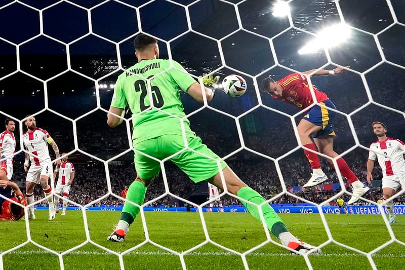 Spain's Fabian Ruiz, second right, scores his side's second goal during a round of sixteen match between Spain and Georgia at the Euro 2024 soccer tournament in Cologne, Germany, Sunday, June 30, 2024. (AP Photo/Frank Augstein)