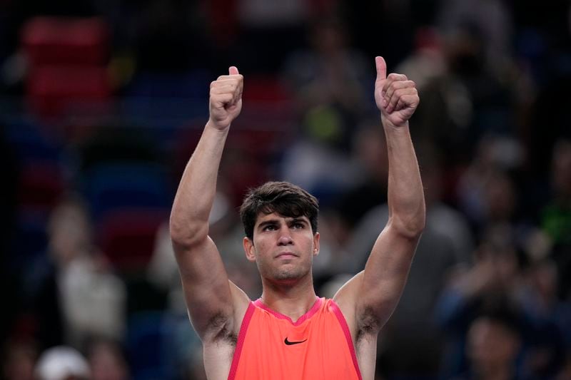 Carlos Alcaraz of Spain celebrates after defeating Wu Yibing of China in the men's singles third round match of the Shanghai Masters tennis tournament at Qizhong Forest Sports City Tennis Center in Shanghai, China, Sunday, Oct. 6, 2024. (AP Photo/Andy Wong)