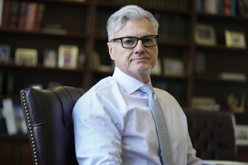 FILE - Judge Juan M. Merchan poses in his chambers in New York, March 14, 2024. The testimony in Donald Trump's hush money trial is all wrapped up after more than four weeks and nearly two dozen witnesses, meaning the case heads into the pivotal final stretch of closing arguments, jury deliberations and possibly a verdict. Merchan is expected to spend about an hour instructing the jury on the law governing the case, providing a roadmap for what it can and cannot take into account as it evaluates Trump's guilt or innocence. (AP Photo/Seth Wenig, File)