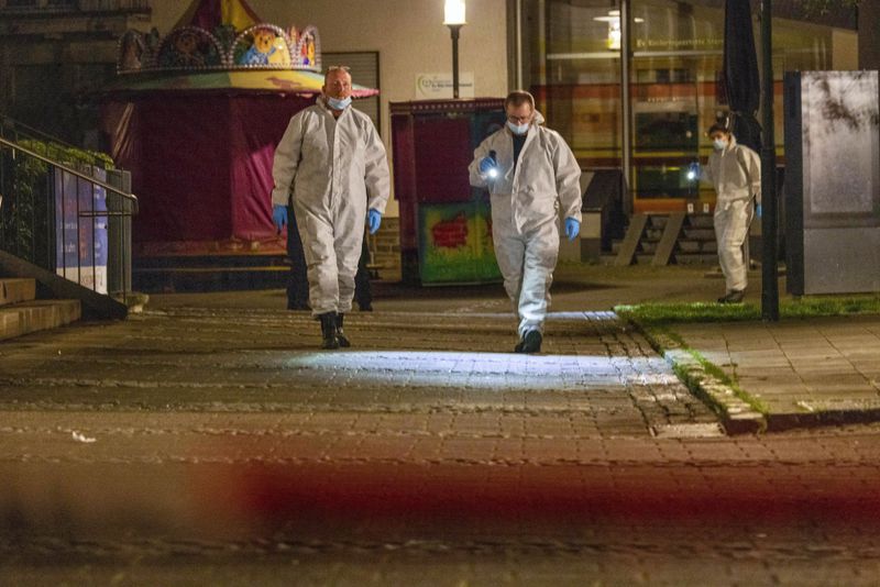 Investigators respond early Saturday, Aug. 24, 2024, after multiple people were killed and injured during an attack late Friday at the 650th anniversary celebrations of the city of Solingen, western Germany. (Thomas Banneyer/dpa via AP)