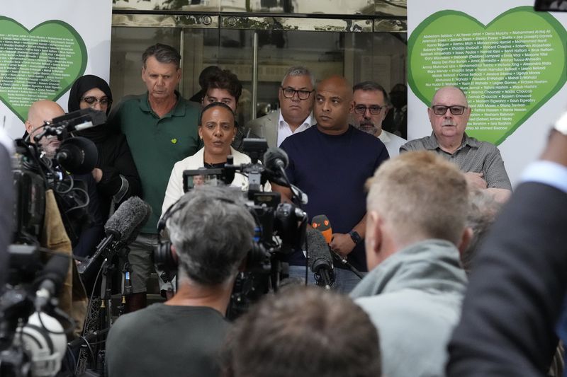 Natasha Elcock a survivor of the Grenfell Tower fire speaks to the media on behalf of relatives of the deceased and people directly affected by the fire a following the final report into the fire being released in London, Wednesday, Sept. 4, 2024. The report on the fire in which 72 people were killed in June 2017, says decades of failure by government and industry made the high-rise a "death trap". (AP Photo/Frank Augstein)