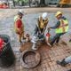 Crews covered a large hole at 11th and West Peachtree streets in Midtown as Mayor Andre Dickens announced Wednesday that water service has been restored.