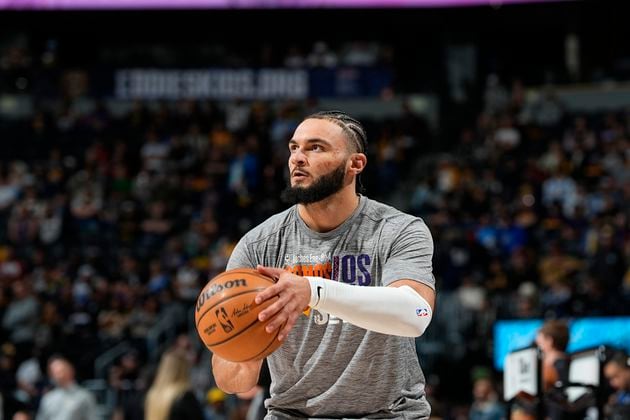 Phoenix Suns forward David Roddy (21) in the first half of an NBA basketball game Tuesday, March 5, 2024, in Denver. (AP Photo/David Zalubowski)