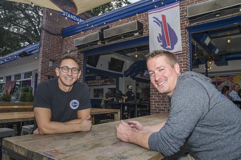 6/20/2019 — Roswell, Georgia —The Standard Bar and Grill business partners Dallas Bond(right) and Jason Chaifetz(left) sit for a portrait at their restaurant in downtown Roswell, Thursday, June 20, 2019. (Alyssa Pointer/alyssa.pointer@ajc.com)