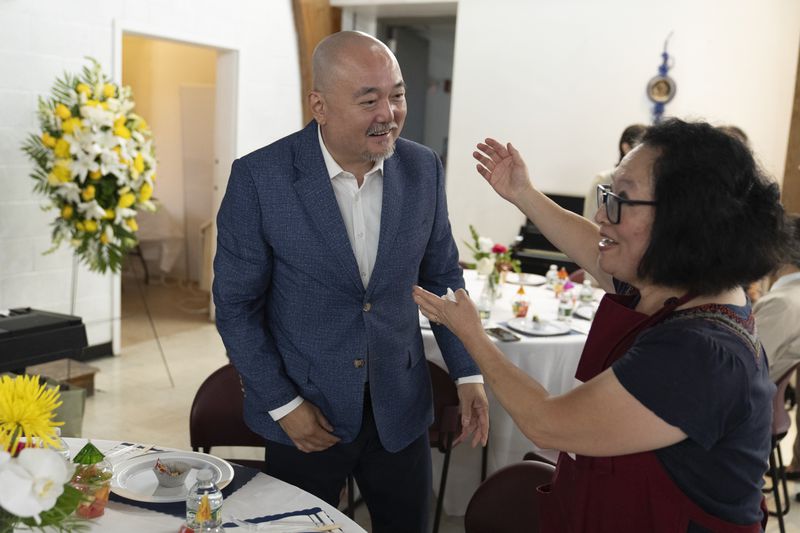 Dr. Soong-Chan Rah speaks wth a parishoner at the Korean Church of Boston, Saturday, Sept. 7, 2024, in Brookline, Mass. (AP Photo/Michael Dwyer)