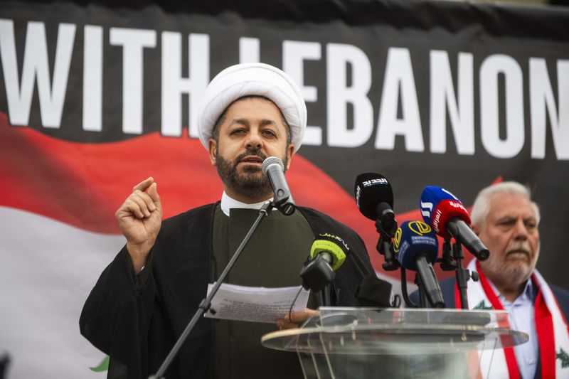 Dr. Baqir Berry of the Islamic Institute of Knowledge speaks to hundreds who gathered for a rally in support of Lebanon in light of recent Israeli strikes that killed hundreds, on Wednesday, Sept. 25, 2024 in front of the Henry Ford Centennial Library in Dearborn, Mich. (Katy Kildee/Detroit News via AP)