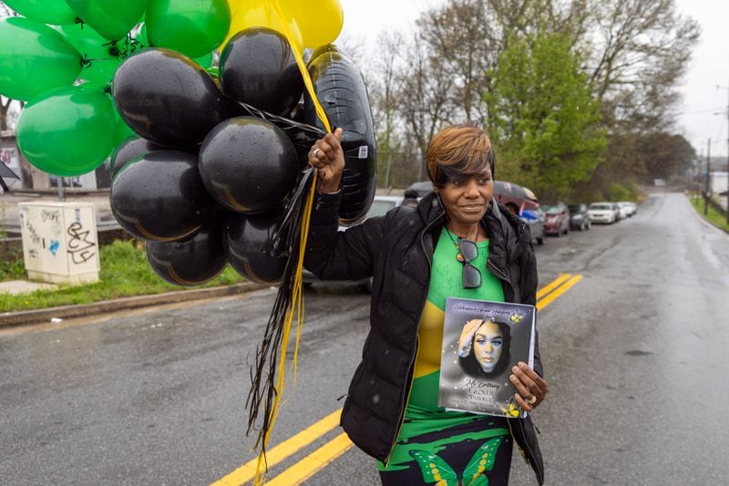 Valerie Handy-Carey, mother of Brittany Glover, walks to the Atlanta intersection where Glover was killed in 2022 in a hit-and-run. A balloon release ceremony took place on what would have been Glover’s 35th birthday on Friday, March 15, 2024. (Arvin Temkar / arvin.temkar@ajc.com)