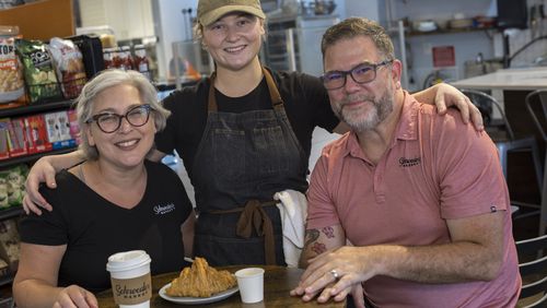 Husband and wife Keith and Nicki Schroeder and their daughter Madison (center) are partners in Schroeder’s Market in Brunswick. (Stephen B. Morton for The Atlanta Journal-Constitution)