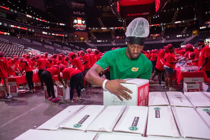  Maurice Nixon, stacked completed boxes of red lentil jambalaya kits for local food banks on pallets.  (Jenni Girtman for The Atlanta Journal-Constitution)