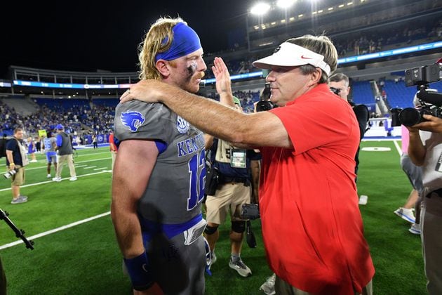 Georgia head coach Kirby Smart and Kentucky quarterback Brock Vandagriff (12) greet each other after Georgia beat Kentucky during an NCAA football game at Kroger Field, Saturday, September 14, 2024,  in Lexington, Kentucky. Georgia won 13-12 over Kentucky. Vandagriff is a former Georgia player. (Hyosub Shin / AJC)